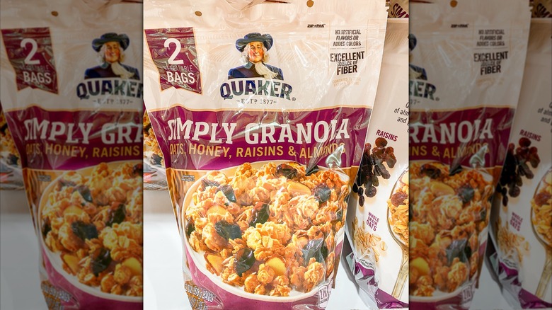 A bag of Quaker Simply Granola on a store shelf.