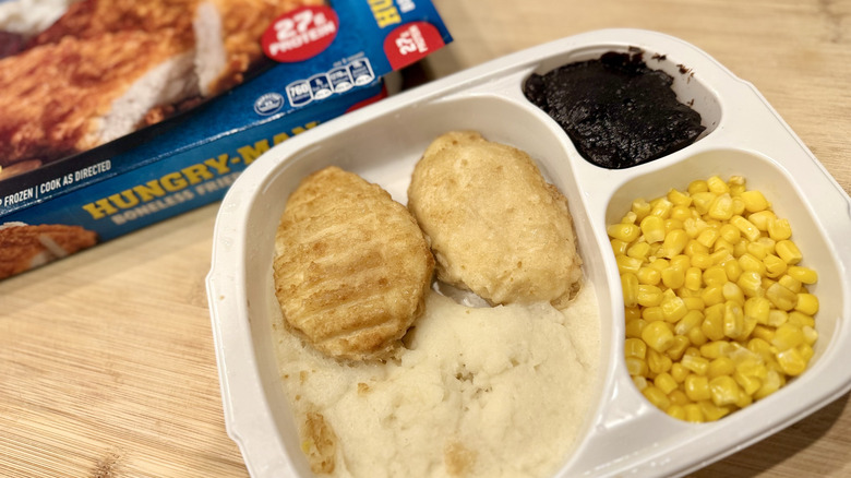 Boneless Fried Chicken in a white tray next to the packaging
