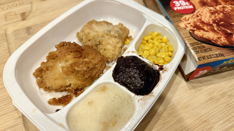 Classic Fried Chicken in a white tray next to the packaging
