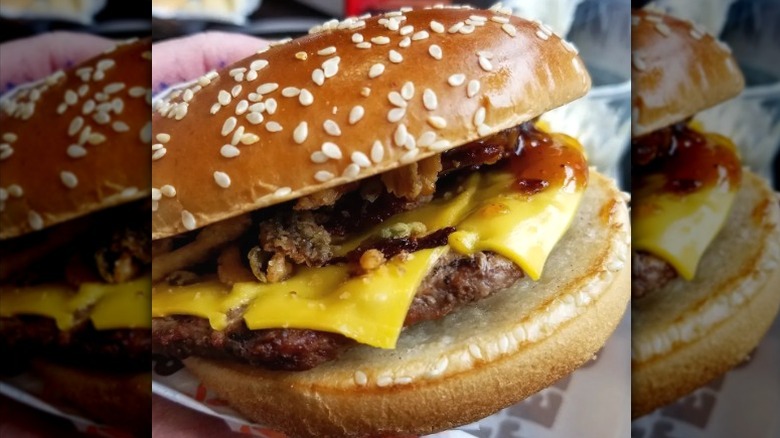 A close-up of a Burger King Maple Bourbon BBQ Whopper.