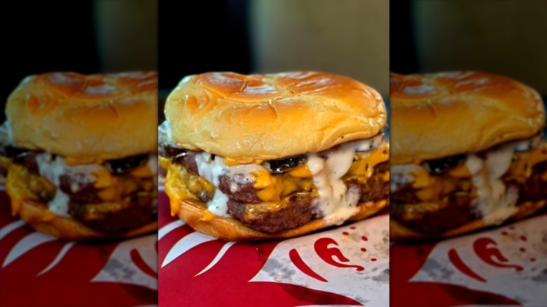 Wendy's Jalapeño Ranch Cheeseburger sitting on a Wendy's wrapper.