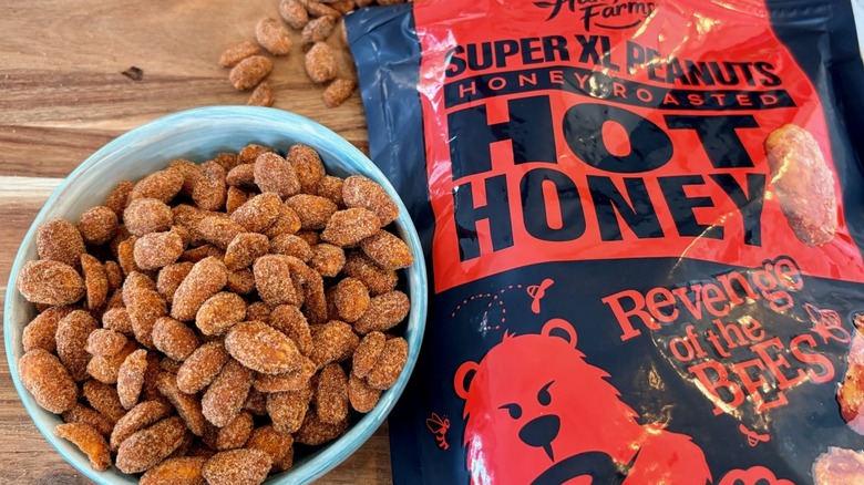 A bag and bowl of Hamptom Farms hot honey roasted peanuts from Costco