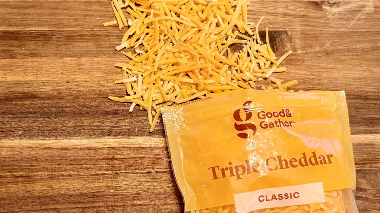 An open bag of Target Good & Gather Triple Cheddar classic shredded cheese