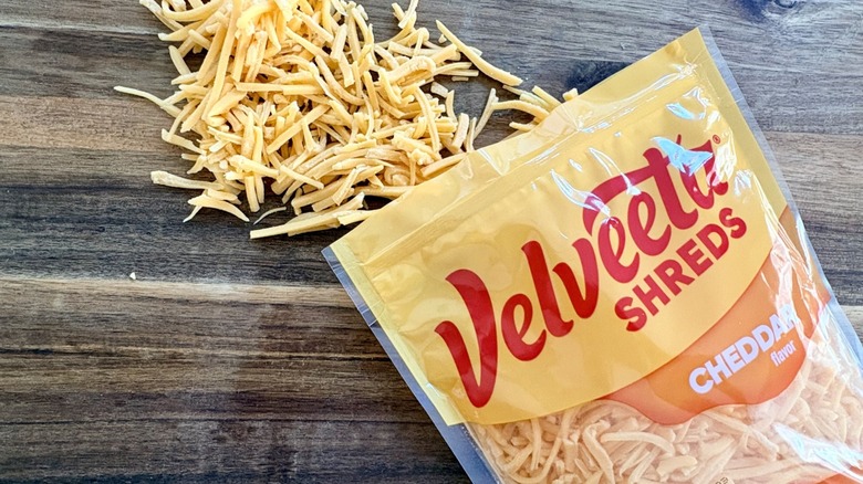 An open bag of Velvetta Shreds cheddar flavor