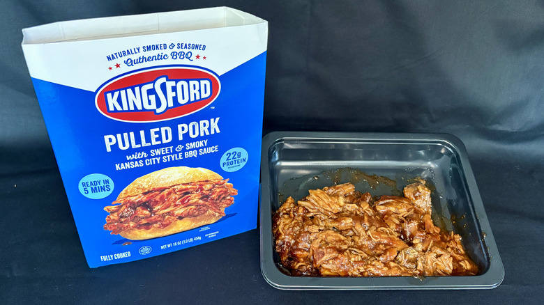 meat in black dish next to Kingsford pulled pork packaging