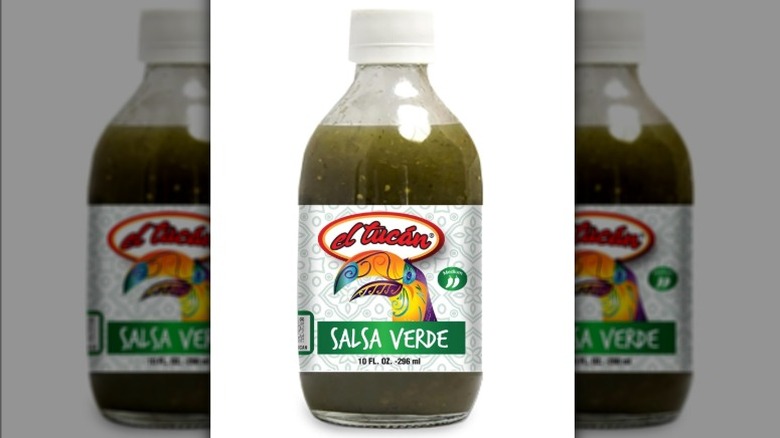 Bottle of El Tucan salsa verde on white background