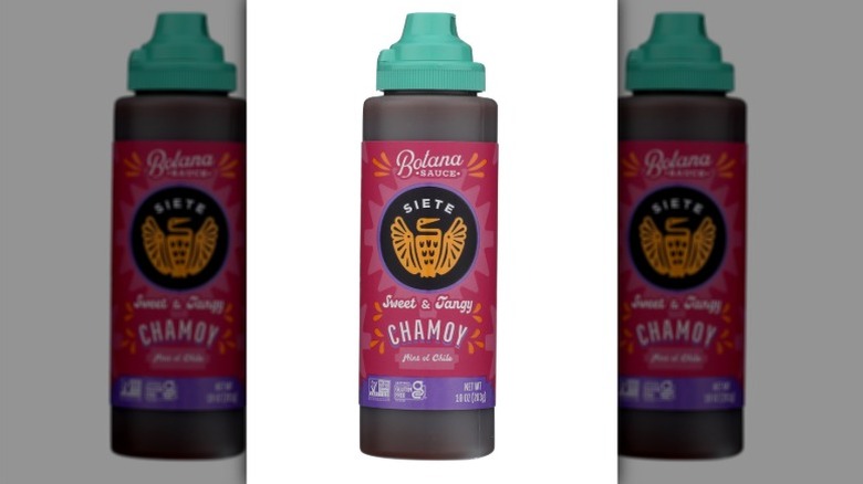 Bottle of Siete Chamoy Botana Sauce on white background