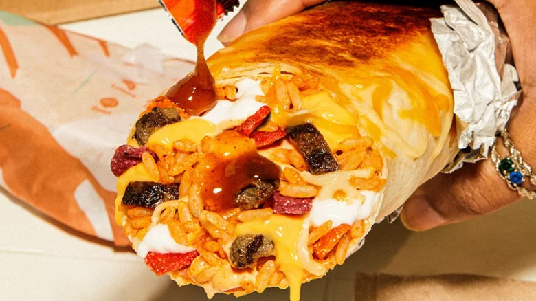 Taco Bell burrito with steak and hot sauce