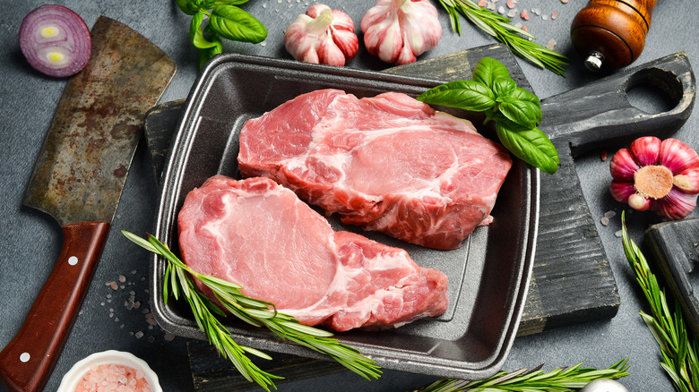Pork in pan with herbs and garlic