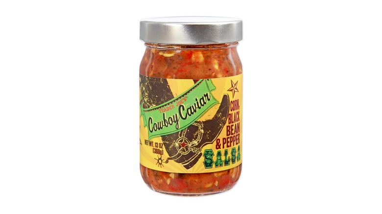 A jar of Trader Joe's Cowboy Caviar Salsa on white background