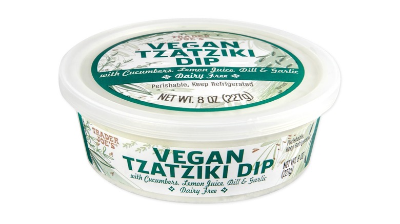 Plastic container of Trader Joe's Vegan Tzatziki Dip on white background