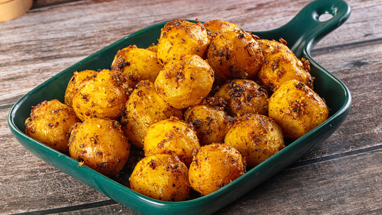 Baked small baby potato with herbs and spices