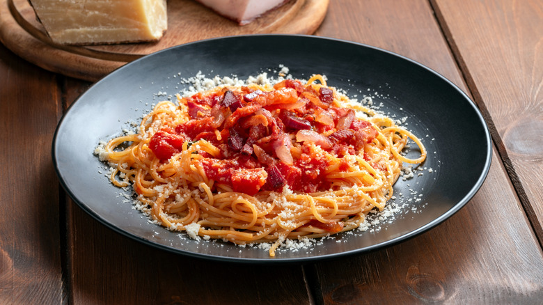 Pasta on plate on wooden table