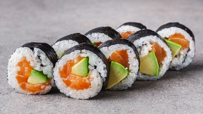 Salmon and avocado maki sushi roll