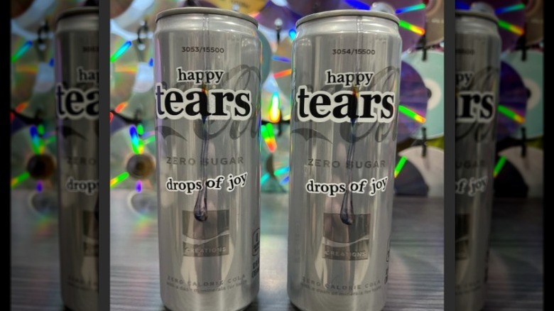 Two cans of Coca-Cola Happy Tears
