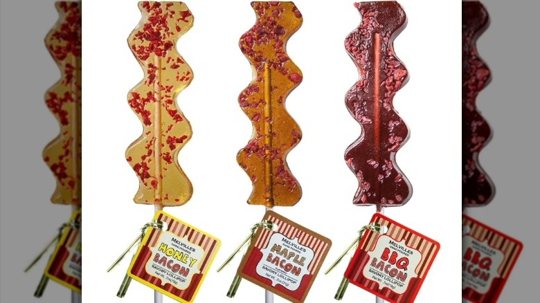 Three different varieties of Melville's Bacon Lollipops on a white background.