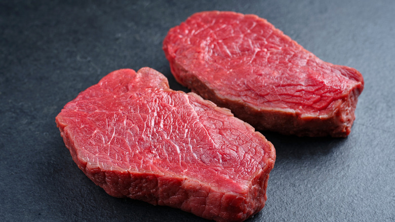 Close up of two thick bottom round steaks