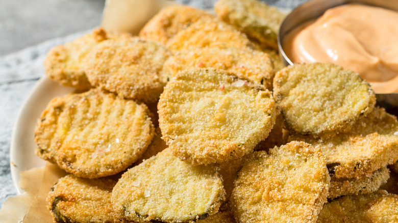 Close-up of fried pickles and dip