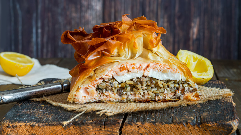Coulibiac de saumon cut to reveal fillings