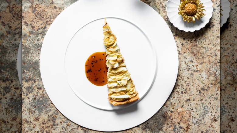 Slice of tarte artichaut at Mirazur