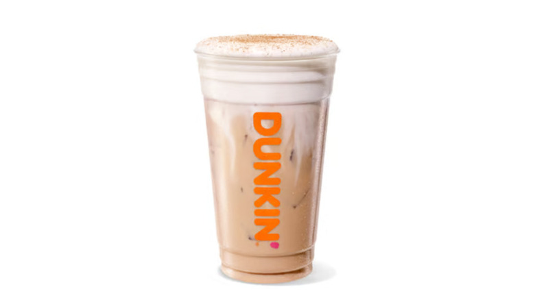 A product image of Dunkin's Harvest Spiced Chai Latte on a white background.