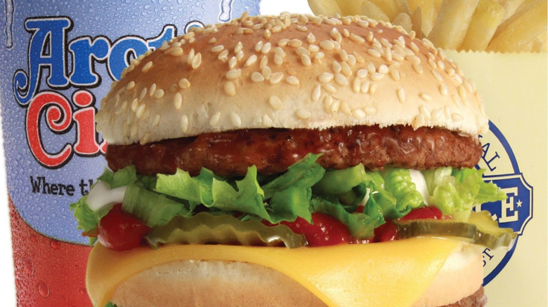 Arctic Circle burger with drink and fries in the background