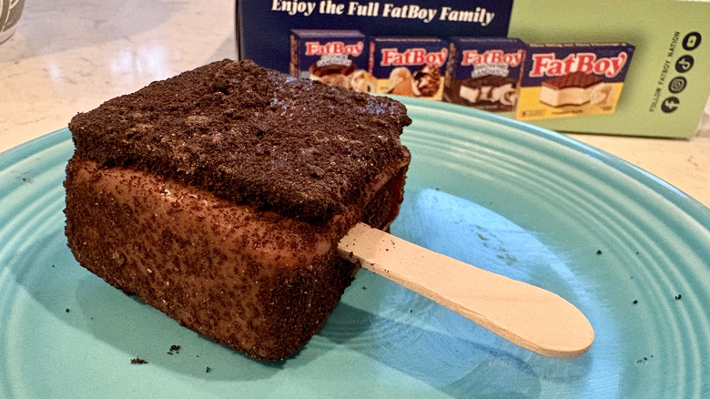 A FatBoy mint cookie ice cream sandwich pop on a plate