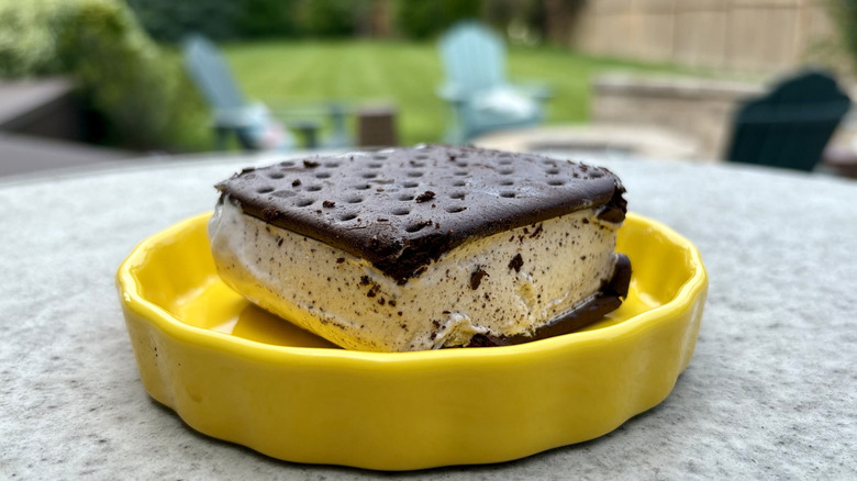 A FatBoy cookies and cream ice cream sandwich in a dish