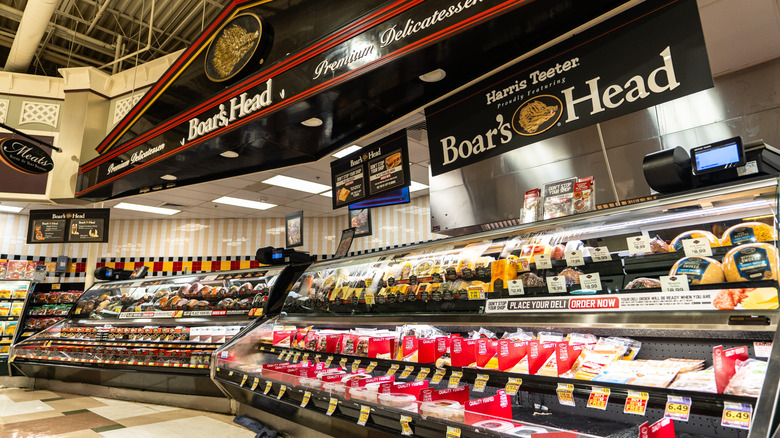 Deli section at Harris Teeter supermarket beneath large Boar's Head signage