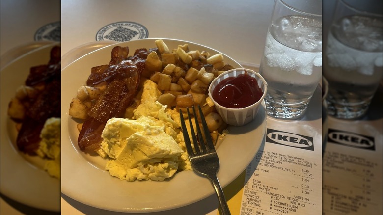The Small Breakfast Plate with a cup of ketchup and a glass of water from Ikea's Swedish Restaurant