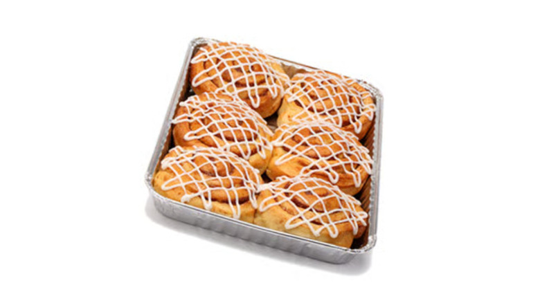 A tray full of the cinnamon buns from the Ikea Swedish Bistro on a white background.