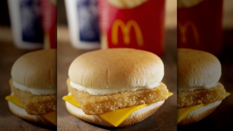 A Filet-O-Fish from McDonald's with fries in the background