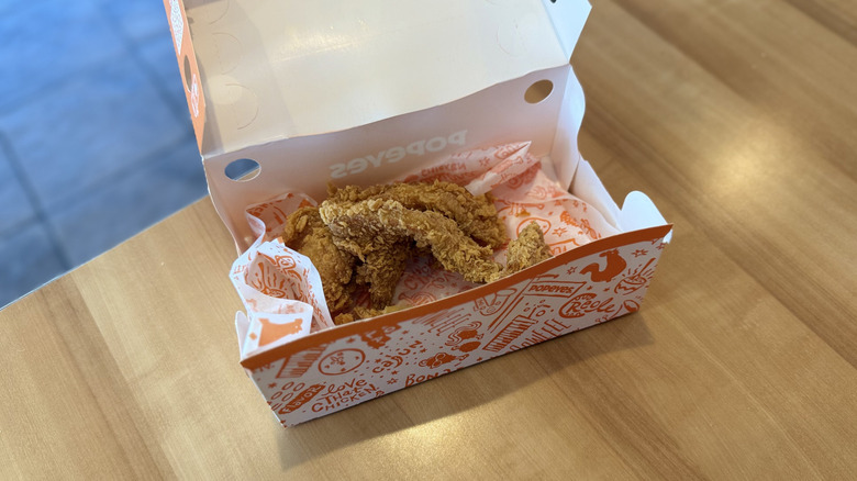Popeyes Chicken Tenders in box on a table