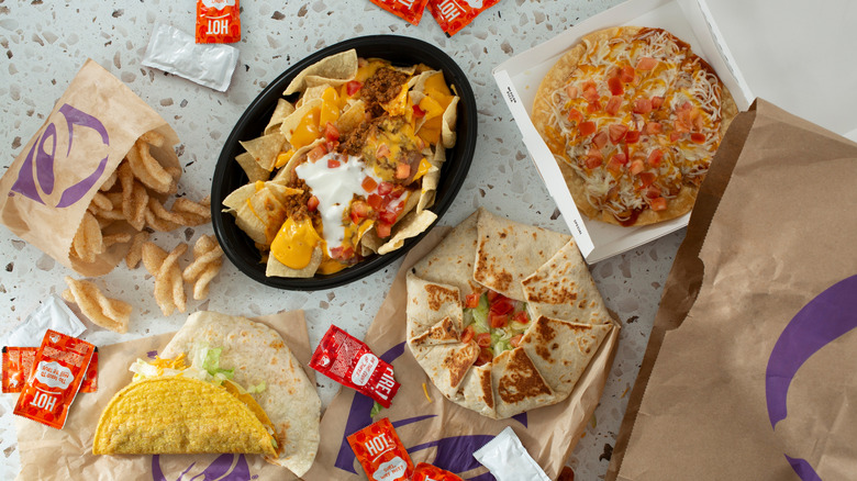 Top-down view of various Taco Bell menu items on table