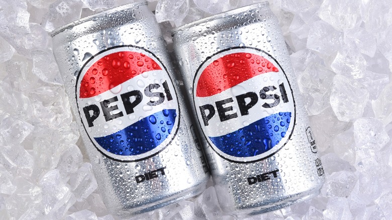 Two cans of Diet Pepsi on ice