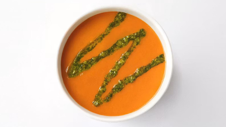 A bowl of Mendocino Farms' Tomato Basil Soup topped with basil pesto