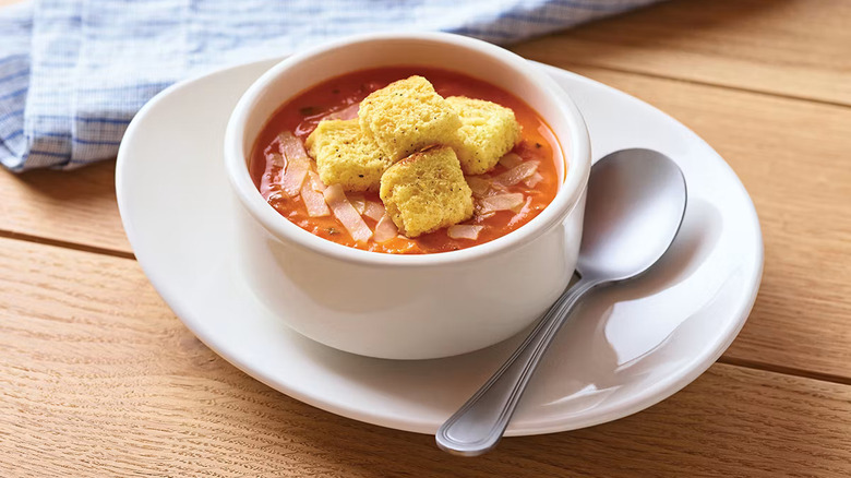 The bowl of tomato soup from Applebee's topped with croutons and parmesan cheese