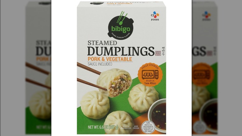 A box of the Bibigo Steamed Pork & Vegetable Dumplings sold at Dollar Tree on white background