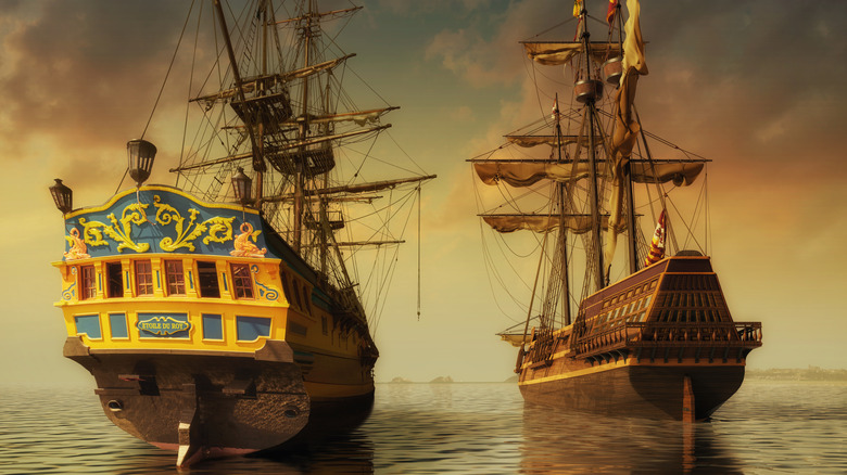 Two ships are floating side-by-side in the sea.