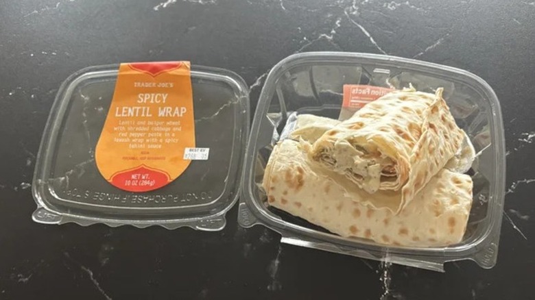Trader Joe's Spicy Lentil Wrap sitting in an opened package on a counter.