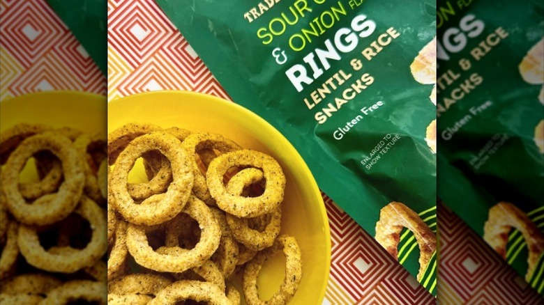 A bowl and bag of Trader Joe's Sour Cream & Onion Flavored Rings.