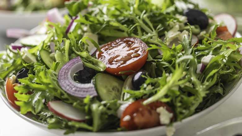 green salad in a white bowl