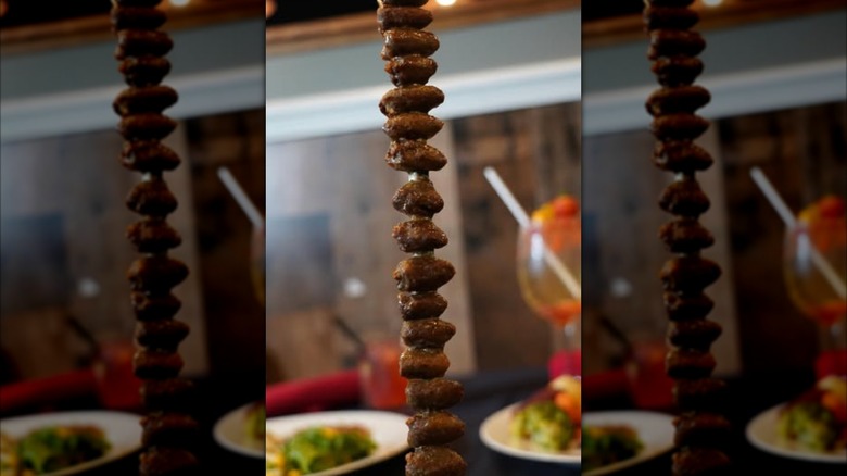 Chicken hearts on skewer at steakhouse