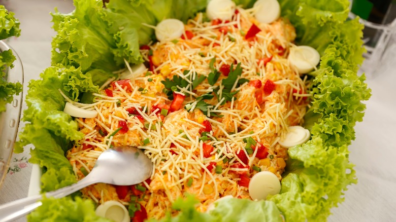 A hefty helping of Brazilian salpicão surrounded by lettuce