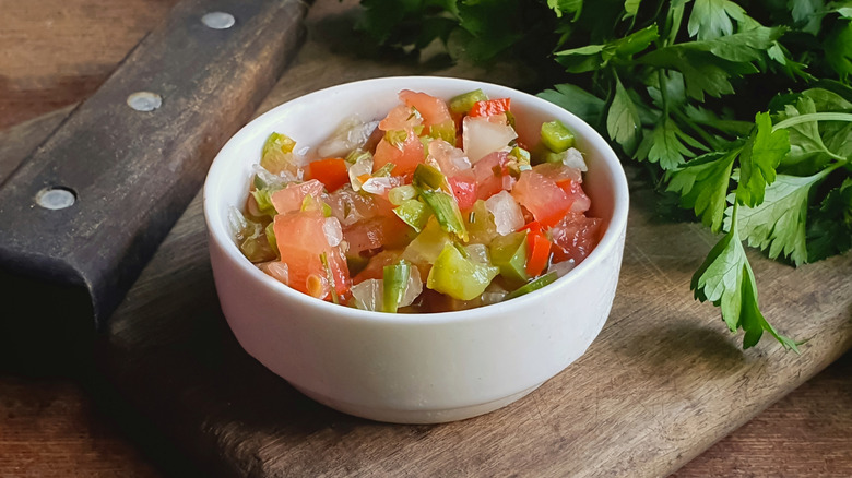 A small white bowl full of vinagrete