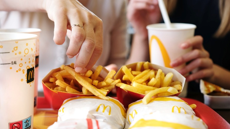 Two people eating McDonald's