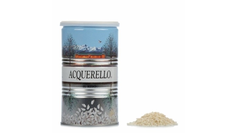 Tin of Aged 1-Year Acquerello Carnaroli Rice from Eataly with a small pile of rice on table beside it