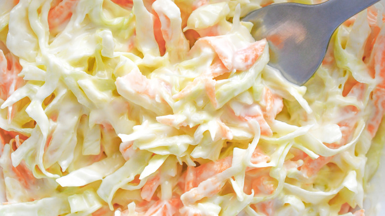 Close-up shot of coleslaw with carrot and cabbage