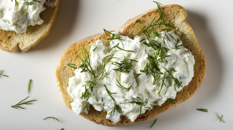 cottage cheese on toast with chives sprinkled on