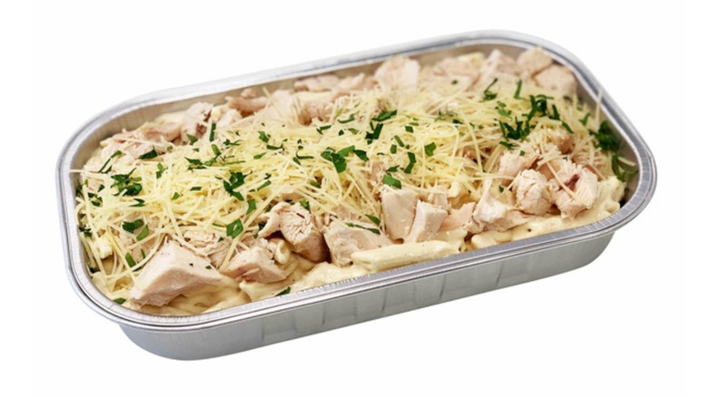 Aluminum pan of Kirkland Signature Chicken Alfredo with Penne Pasta from Costco that comes oven ready